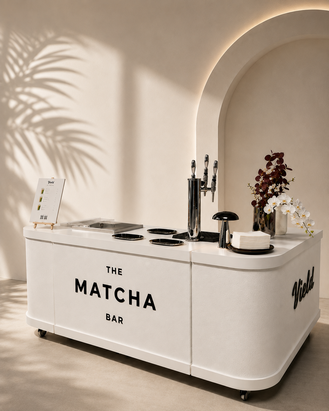 The Yield matcha bar pop-up cart styled with orchids and a chrome tap tower